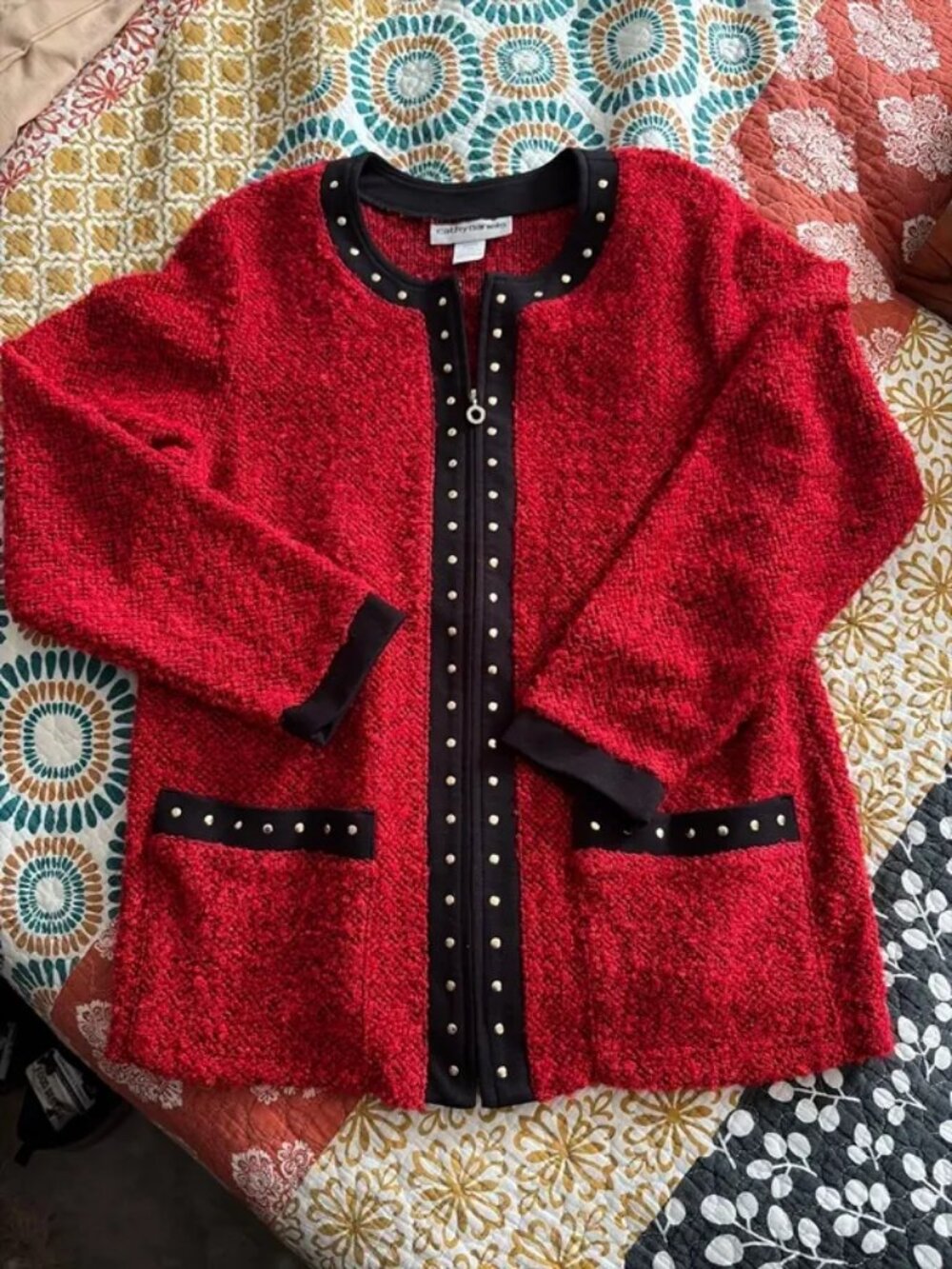 Cathy Daniel’s medium red zip up sweater